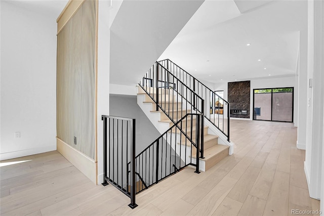 1491 S York St, Denver, CO 80210 - stairs featuring wood finished floors and recessed lighting
