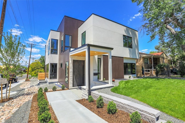 1491 S York St, Denver, CO 80210 - contemporary home featuring a front yard and a balcony