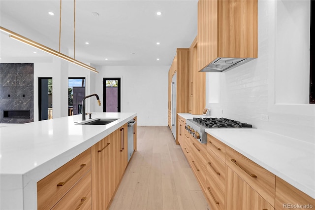 1491 S York St, Denver, CO 80210 - kitchen featuring appliances with stainless steel finishes, custom range hood, light brown cabinetry, modern cabinets, and recessed lighting