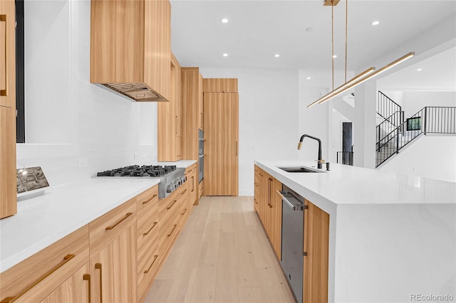 1491 S York St, Denver, CO 80210 - kitchen featuring modern cabinets, light brown cabinets, appliances with stainless steel finishes, custom range hood, and recessed lighting