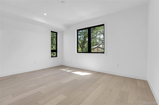 1491 S York St, Denver, CO 80210 - empty room featuring light wood-style floors and recessed lighting