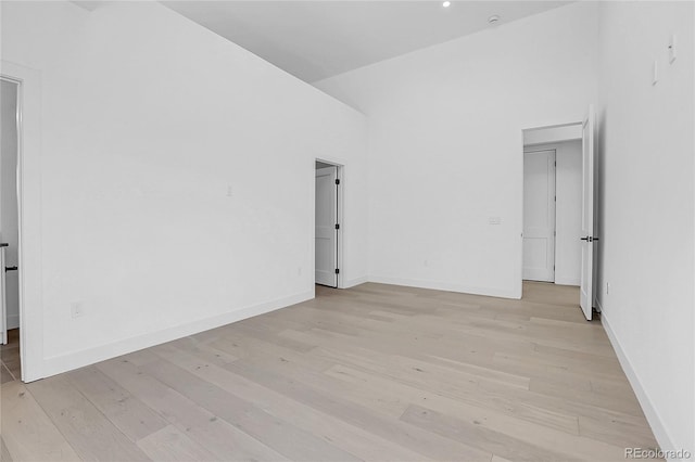 1491 S York St, Denver, CO 80210 - unfurnished room featuring light wood-type flooring and a high ceiling