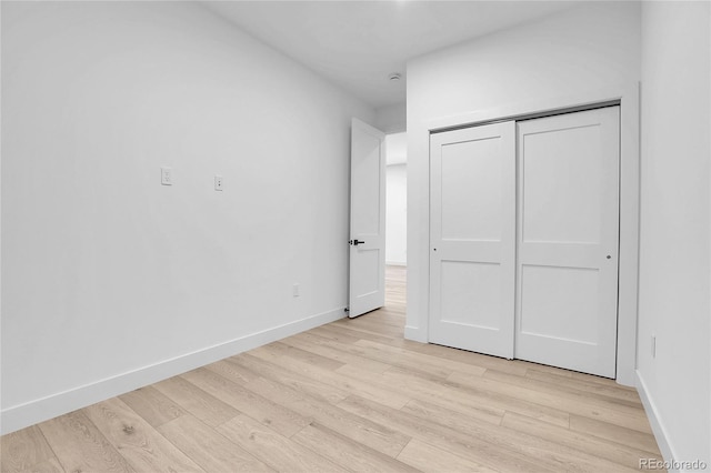 1491 S York St, Denver, CO 80210 - unfurnished bedroom featuring light wood-type flooring and a closet