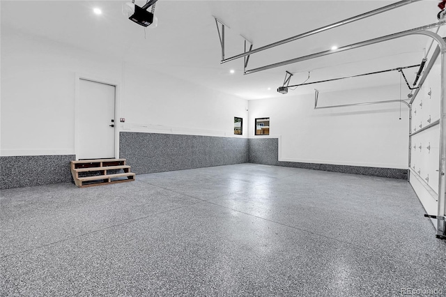 1491 S York St, Denver, CO 80210 - garage featuring wainscoting and a garage door opener