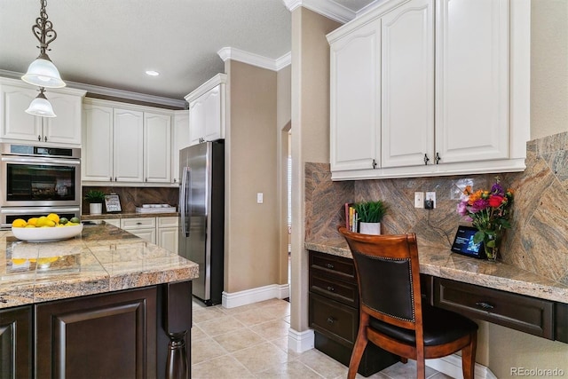 kitchen with white cabinets, stainless steel appliances, ornamental molding, and tasteful backsplash