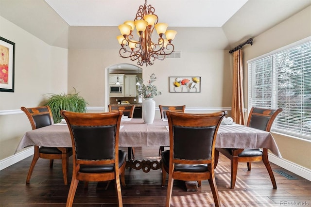 dining room featuring a notable chandelier and wood-type flooring