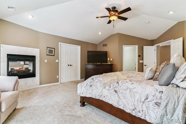 carpeted bedroom with lofted ceiling, a multi sided fireplace, and ceiling fan