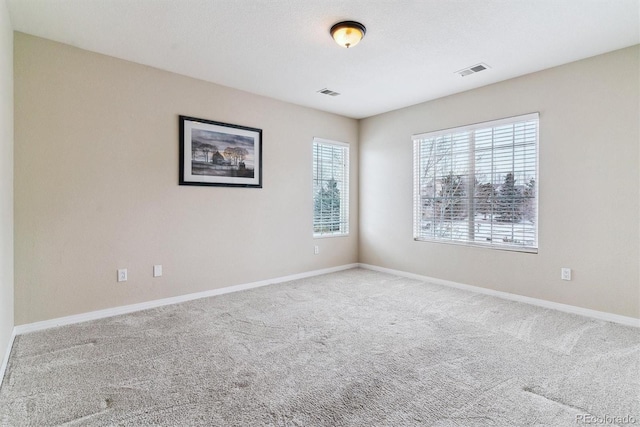 empty room featuring carpet flooring