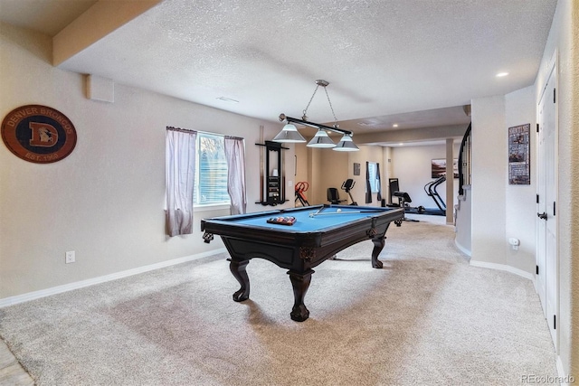 game room featuring light colored carpet, a textured ceiling, and pool table