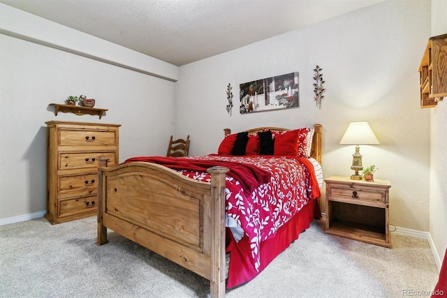 bedroom featuring light carpet