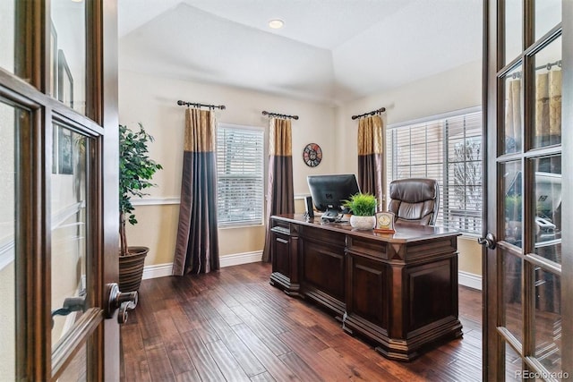 office area featuring vaulted ceiling, french doors, a raised ceiling, and dark wood-type flooring