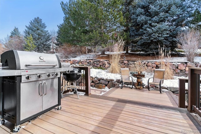 wooden deck with area for grilling