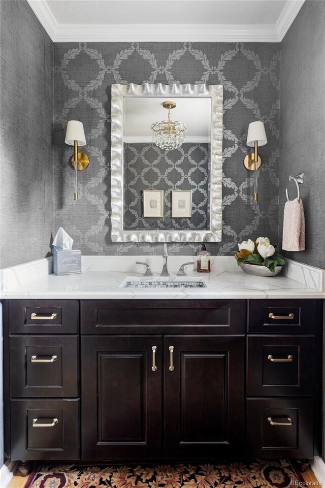 2209 Green Oaks Ln, Greenwood Village, CO 80121 - bathroom featuring vanity, crown molding, wallpapered walls, and wood finished floors