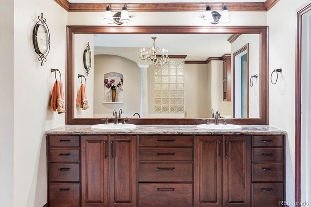 2209 Green Oaks Ln, Greenwood Village, CO 80121 - bathroom with a chandelier, double vanity, and crown molding