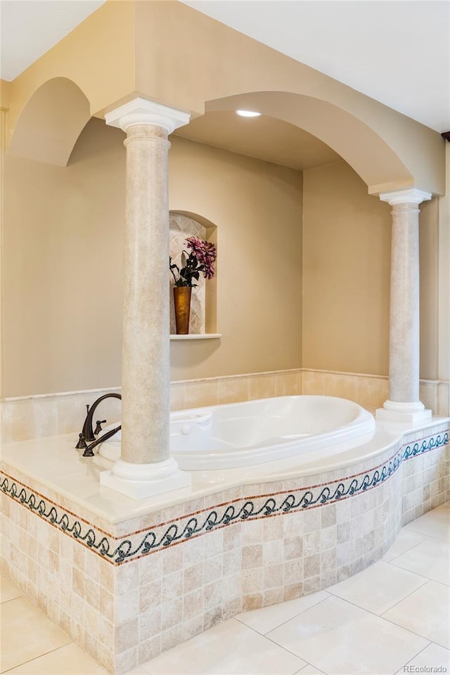 2209 Green Oaks Ln, Greenwood Village, CO 80121 - bathroom featuring ornate columns, tile patterned flooring, and a garden tub