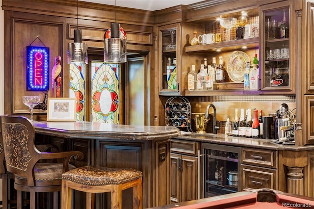 2209 Green Oaks Ln, Greenwood Village, CO 80121 - indoor wet bar with beverage cooler and hanging light fixtures