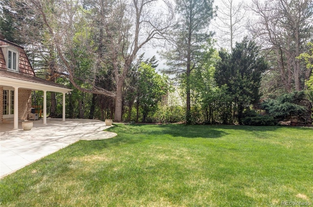 2209 Green Oaks Ln, Greenwood Village, CO 80121 - view of grassy yard with a patio