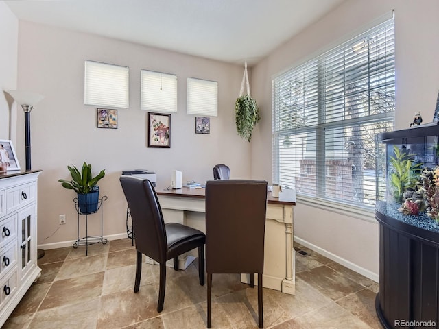 2676 S Troy Ct, Aurora, CO 80014 - dining space featuring baseboards