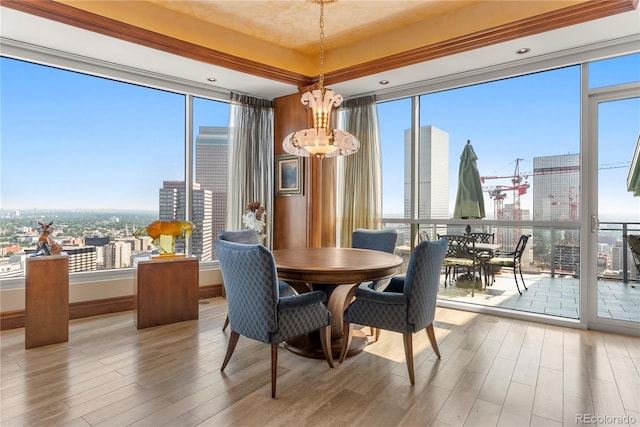 dining space with a notable chandelier and hardwood / wood-style floors