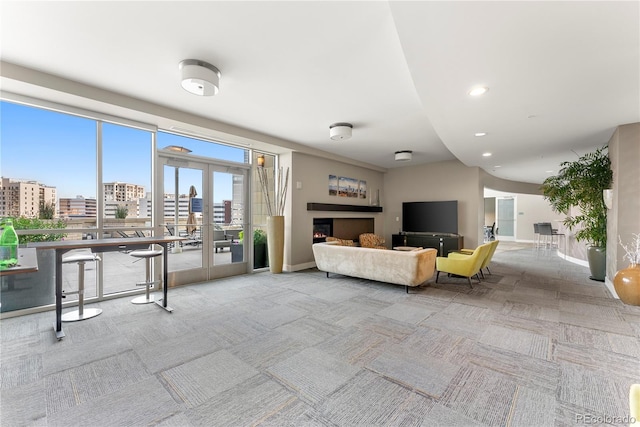 carpeted living room featuring french doors