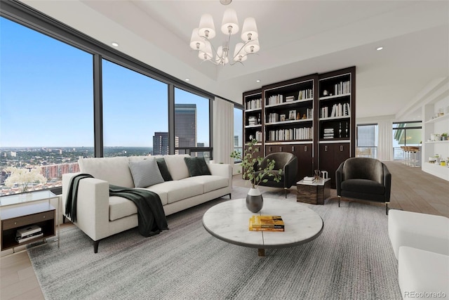 living room featuring plenty of natural light and an inviting chandelier