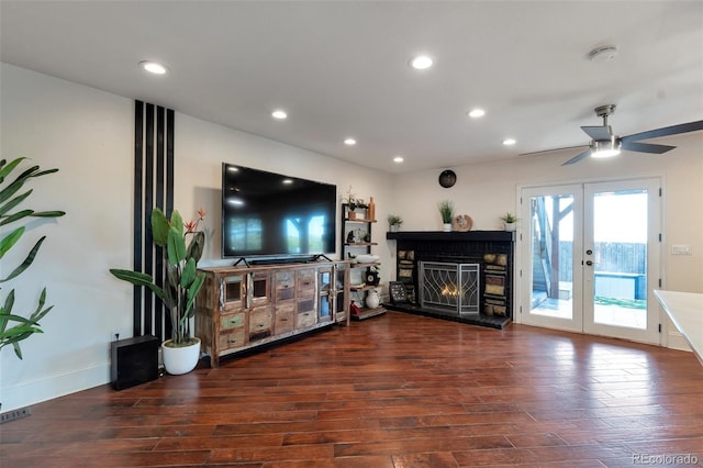 3807 S Atchison Way, Aurora, CO 80014 - living area with wood finished floors, french doors, recessed lighting, ceiling fan, and a lit fireplace