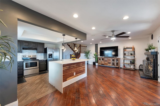 3807 S Atchison Way, Aurora, CO 80014 - kitchen featuring appliances with stainless steel finishes, light countertops, dark wood-style flooring, a ceiling fan, and recessed lighting