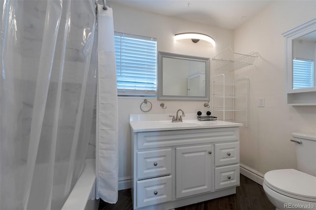 3807 S Atchison Way, Aurora, CO 80014 - full bathroom featuring vanity, wood finished floors, and shower / tub combo with curtain
