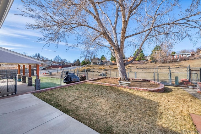 view of yard with a gate and fence