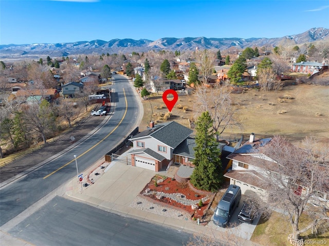 drone / aerial view with a mountain view and a residential view