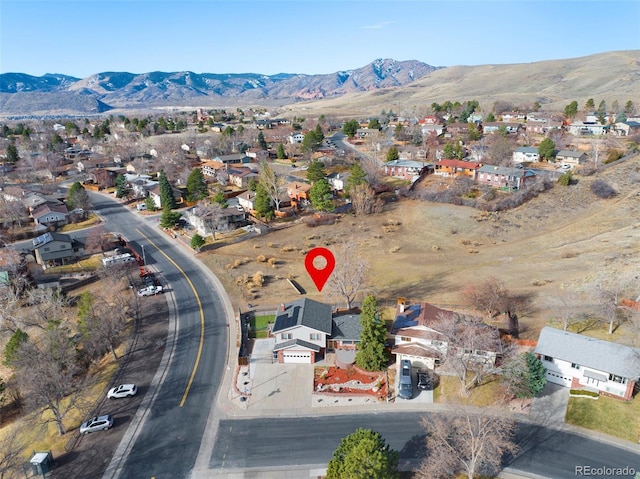 drone / aerial view with a mountain view and a residential view