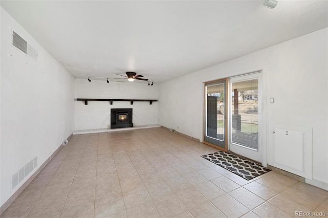 unfurnished living room featuring light tile patterned floors, visible vents, and ceiling fan