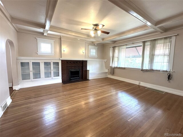 unfurnished living room featuring dark hardwood / wood-style floors, a healthy amount of sunlight, and ceiling fan