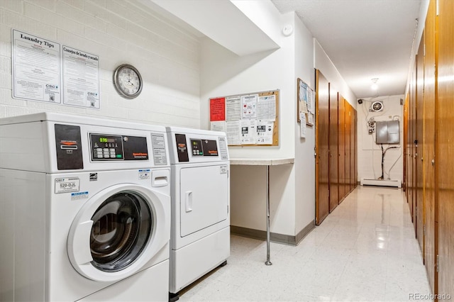 laundry area with washing machine and dryer