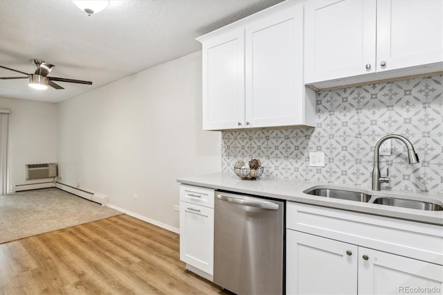 kitchen with light hardwood / wood-style flooring, sink, white cabinetry, a baseboard heating unit, and stainless steel dishwasher