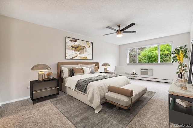 bedroom with carpet floors, a textured ceiling, and baseboard heating