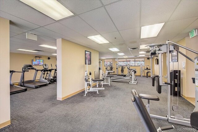 exercise room featuring a paneled ceiling