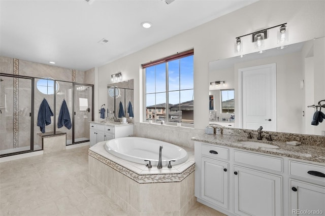 10468 Ladera Dr, Lone Tree, CO 80124 - bathroom featuring a stall shower, two vanities, a bath, and tile patterned flooring