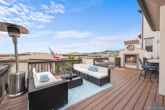 10468 Ladera Dr, Lone Tree, CO 80124 - wooden terrace with an outdoor living space with a fireplace