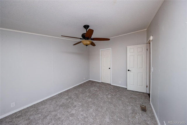 unfurnished bedroom with a textured ceiling, carpet floors, a closet, ceiling fan, and crown molding