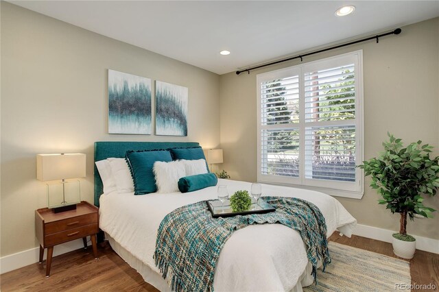 bedroom with wood-type flooring