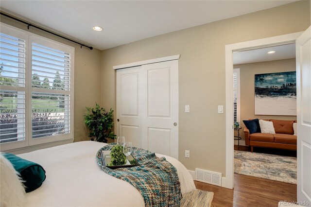 bedroom featuring a closet and dark wood-type flooring