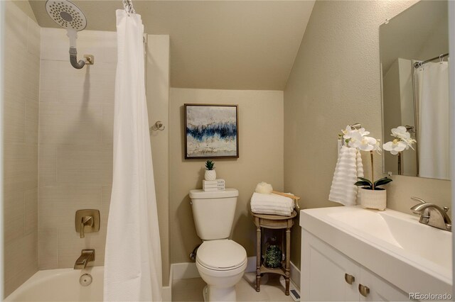 full bathroom with shower / bath combo with shower curtain, tile patterned flooring, vanity, and toilet