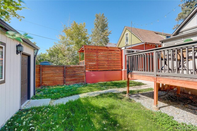 view of yard with a deck