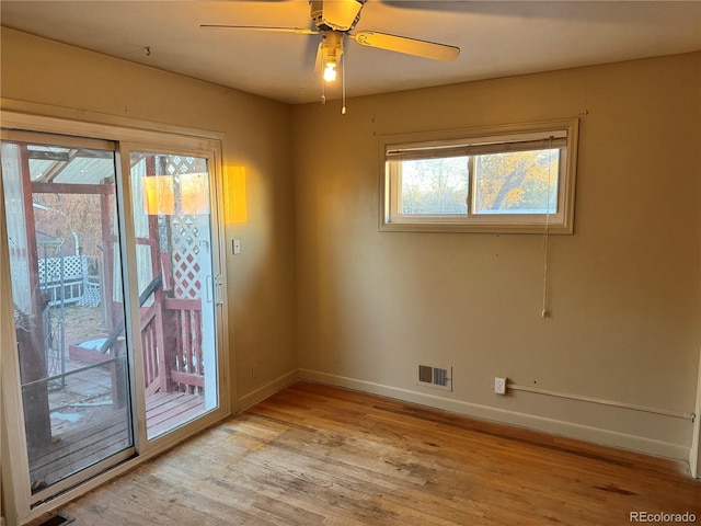 empty room featuring ceiling fan and light hardwood / wood-style flooring