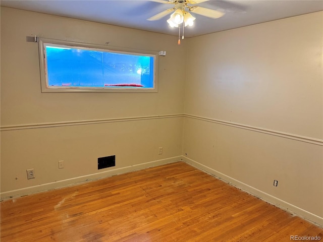 empty room with light hardwood / wood-style flooring and ceiling fan