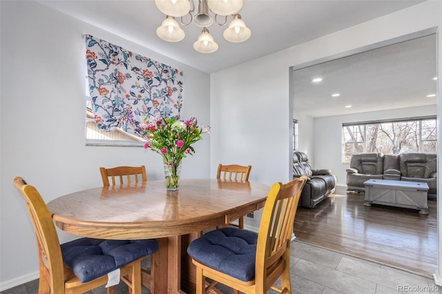 dining space featuring a chandelier, recessed lighting, wood finished floors, and baseboards