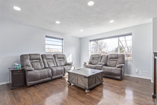 living room featuring baseboards, dark wood-style flooring, and recessed lighting