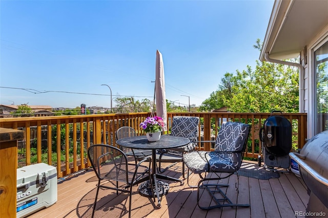 1081 E 119th Pl, Northglenn, CO 80233 - deck featuring outdoor dining space and area for grilling