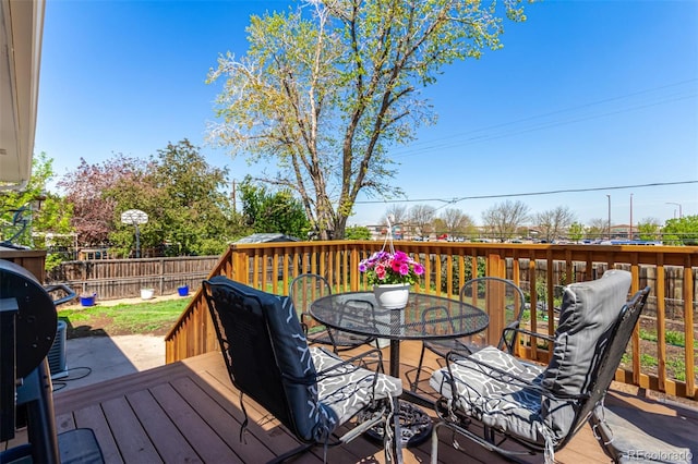 1081 E 119th Pl, Northglenn, CO 80233 - deck featuring outdoor dining space and a fenced backyard